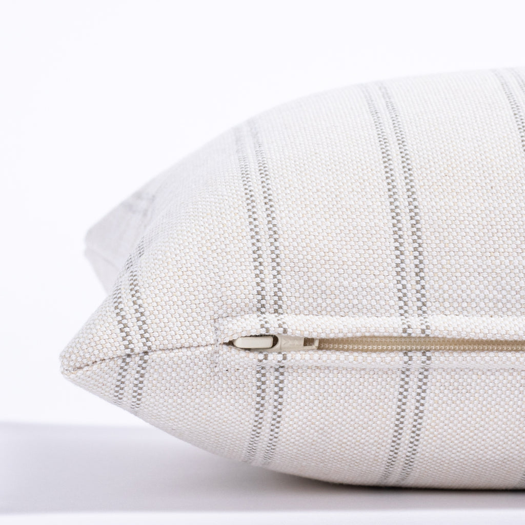 cream and grey vertical stripe lumbar pillow : side close up view