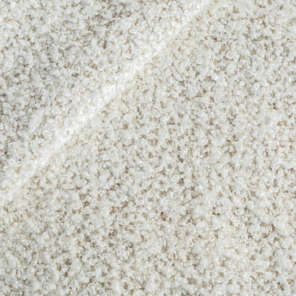 a cream boucle upholstery fabric from Tonic Living
