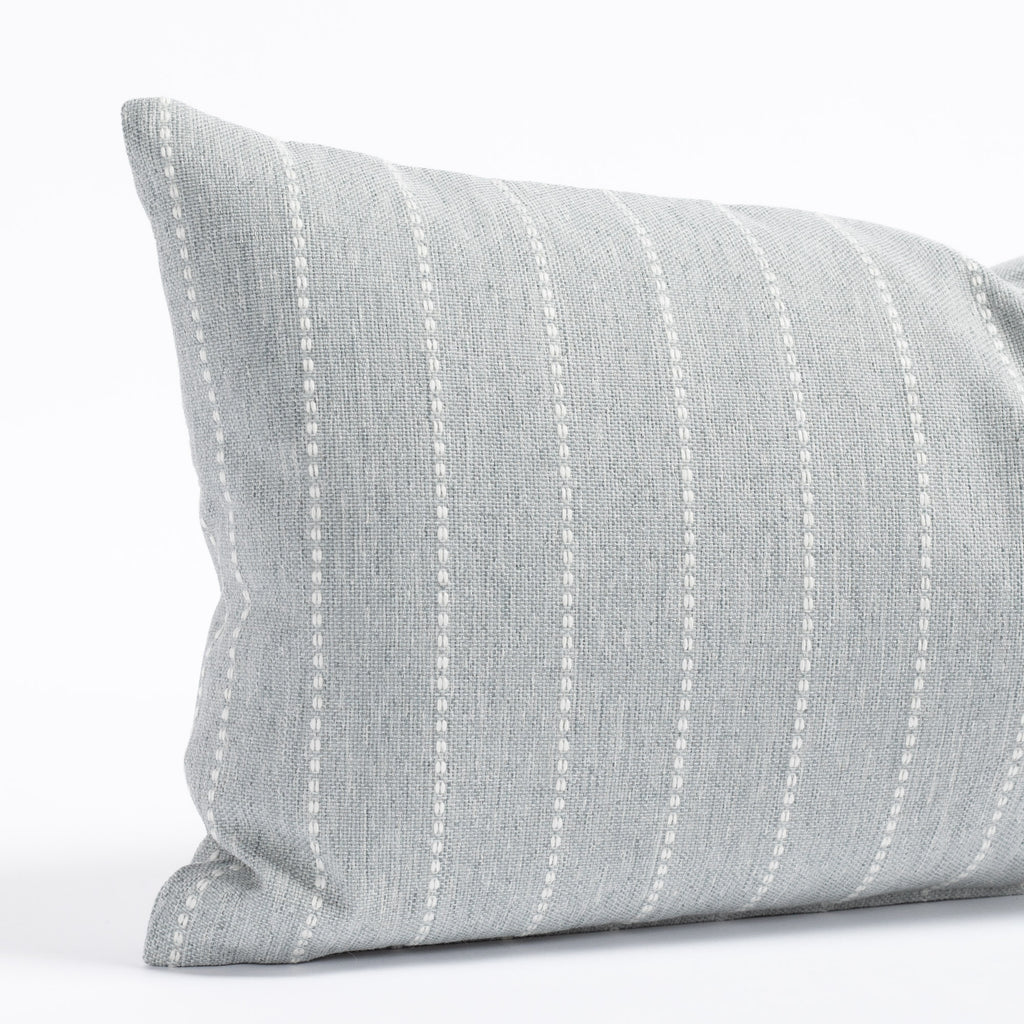 a blue grey with white stripe indoor outdoor lumbar pillow