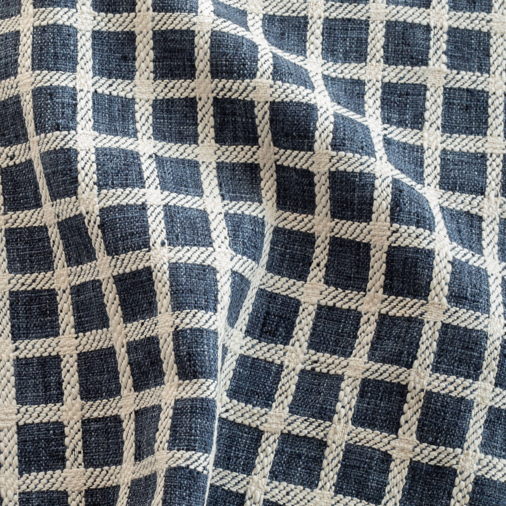 a dark blue and cream check home decor fabric