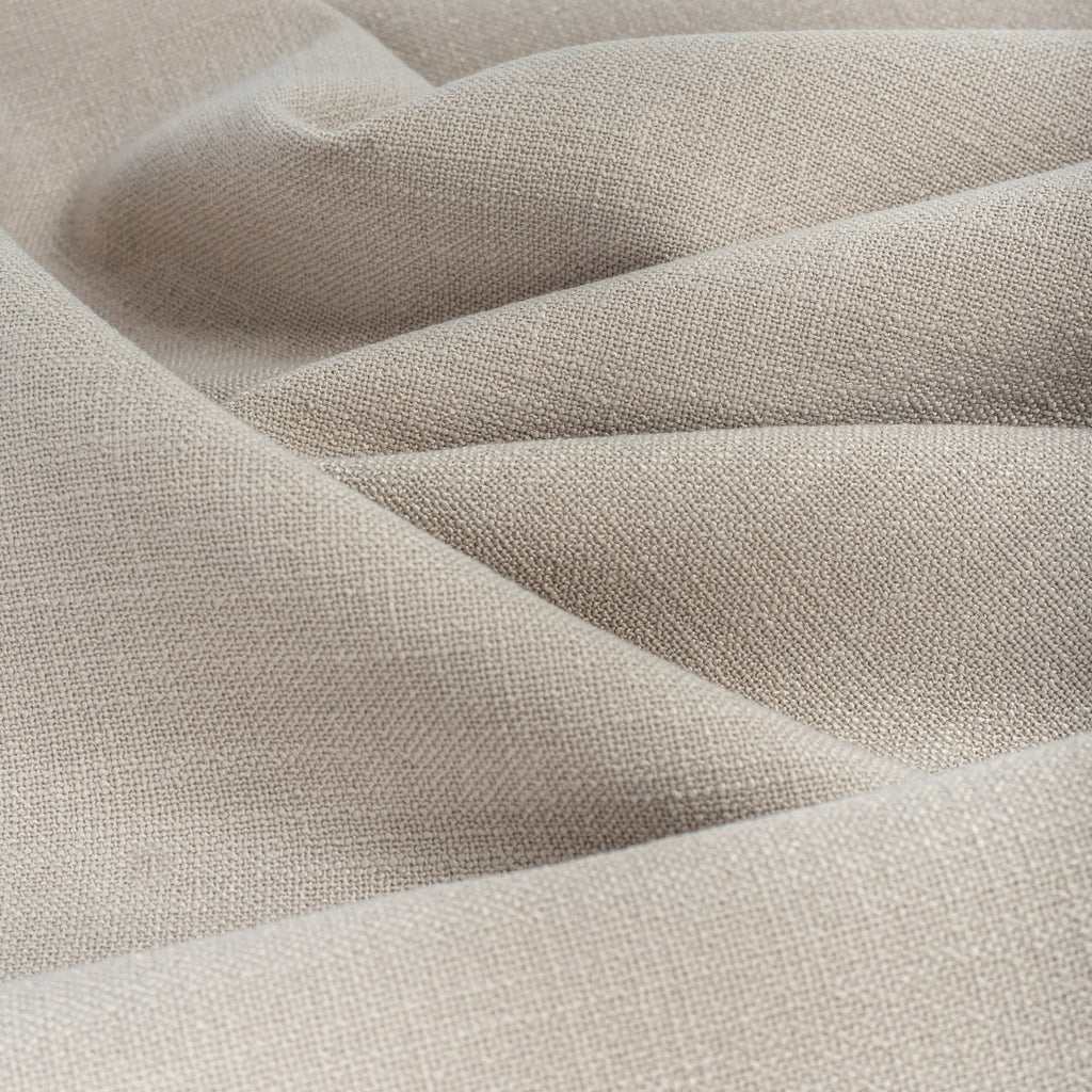 Grange Fabric Pumice, an earthy grey high performance upholstery fabric with a subtle textural weave from Tonic Living