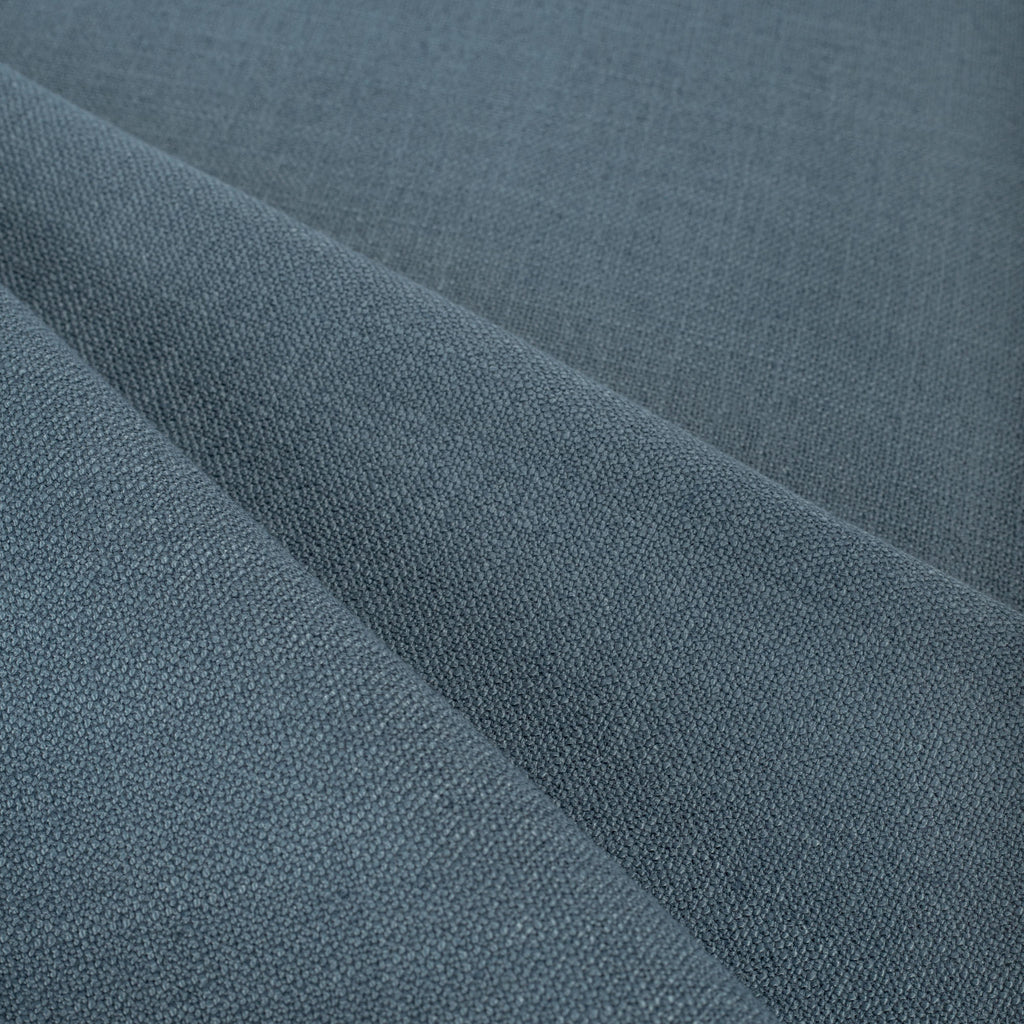 Grange Fabric Storm Blue, a high performance denim blue upholstery fabric : close up view