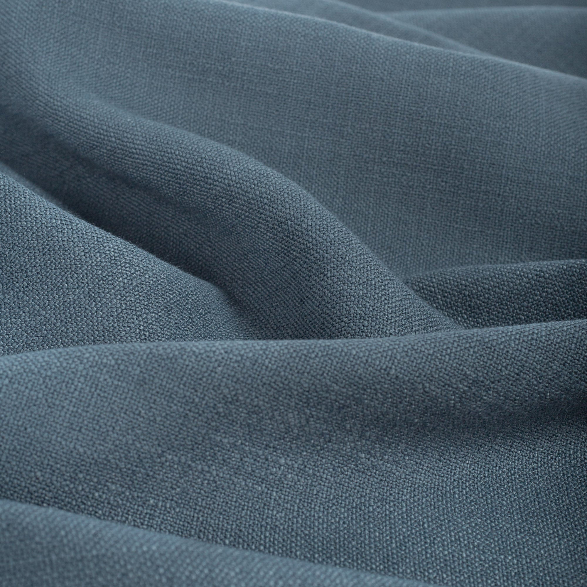 Grange Fabric Storm Blue, a high performance denim blue upholstery fabric with a subtle textural weave from Tonic Living
