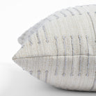 Harlow Desert Sand, a sandy cream pillow with dove gray dashes : close up side view