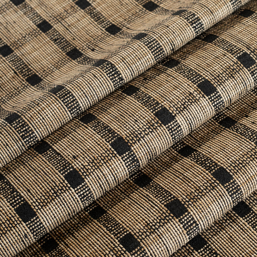 a tan brown and black woven check fabric : close up