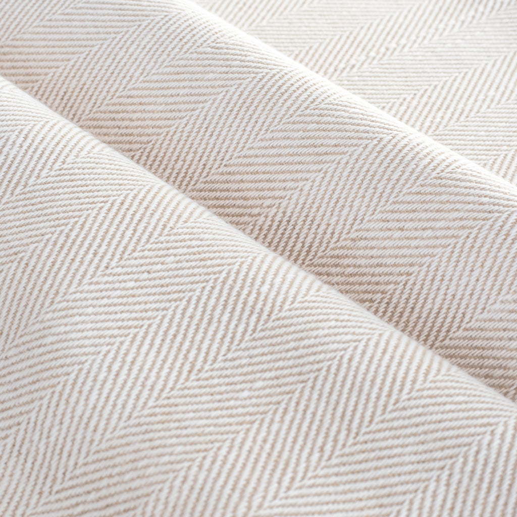 a cream and tan herringbone stain resistant upholstery fabric 