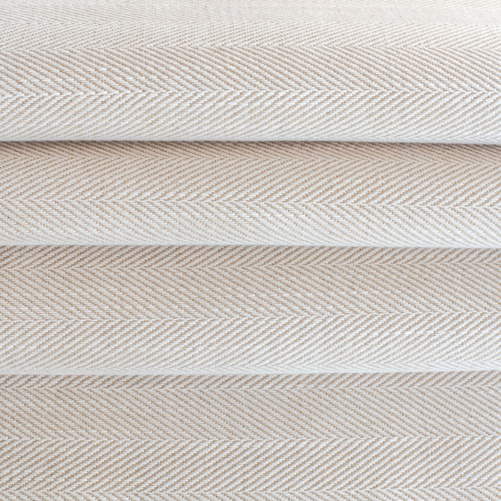 a cream and beige herringbone performance upholstery fabric 