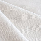 Harris White, a soft white herringbone pattern performance upholstery fabric from Tonic Living