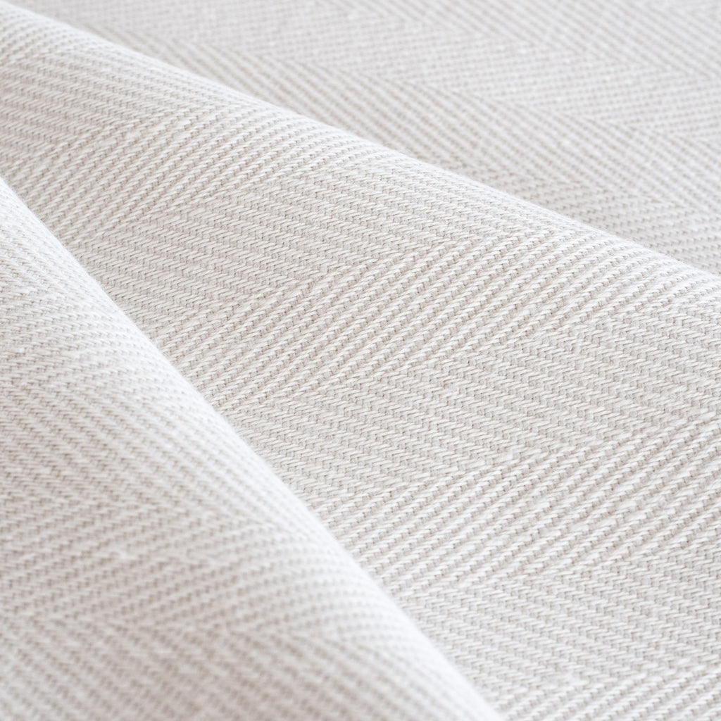 Harris White, a soft white herringbone pattern performance upholstery fabric from Tonic Living
