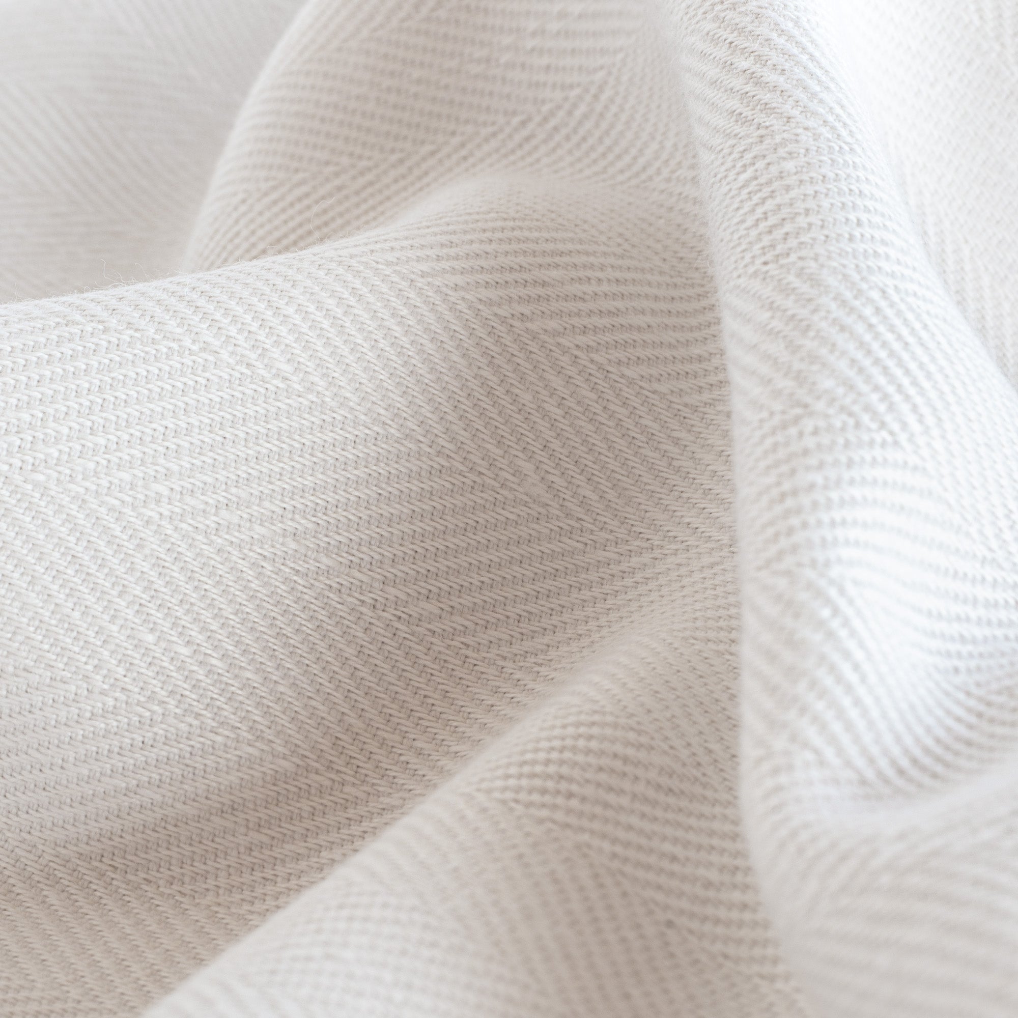 Harris White, a soft white herringbone pattern performance upholstery fabric