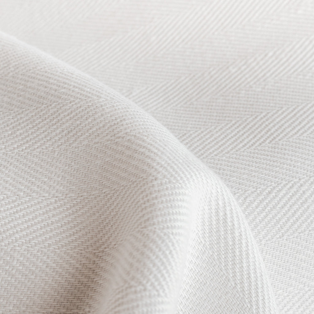 Harris White, a soft white herringbone pattern performance upholstery fabric