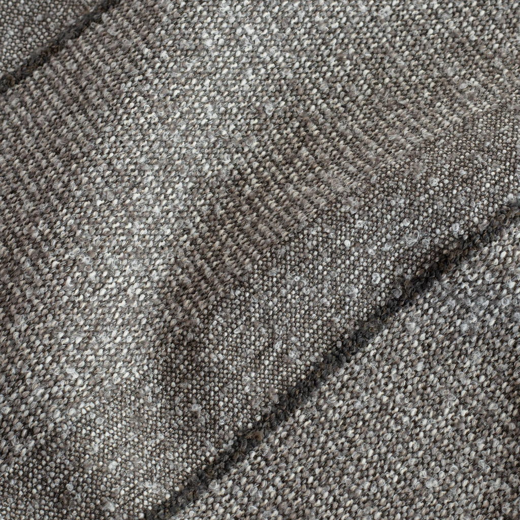 a textured tonal grey stripe upholstery fabric : close up view