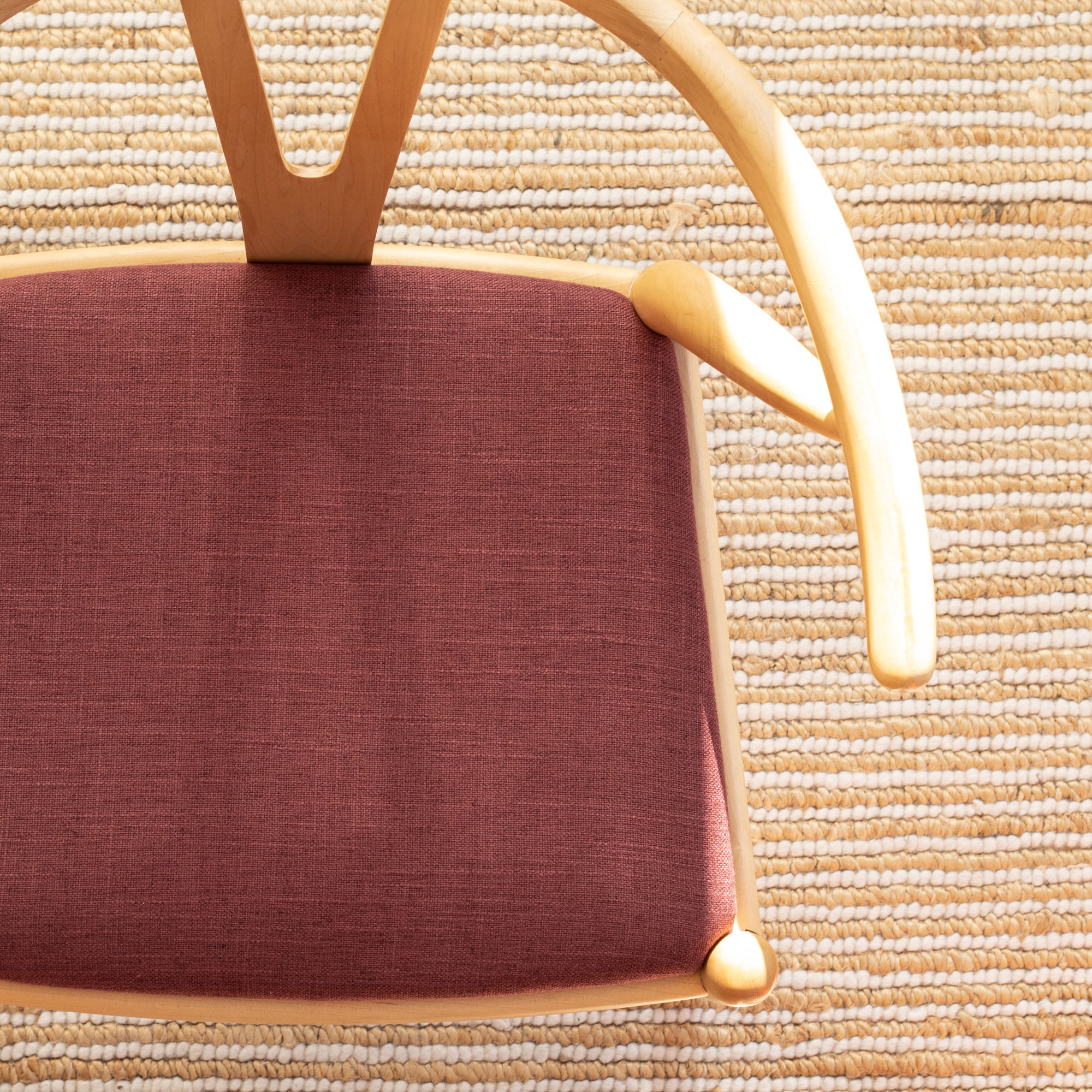 a merlot red upholstered chair seat