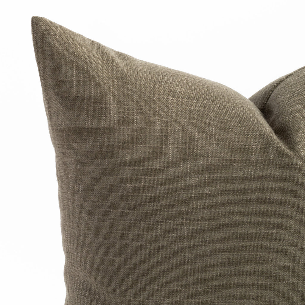a moss green throw pillow : close up photo