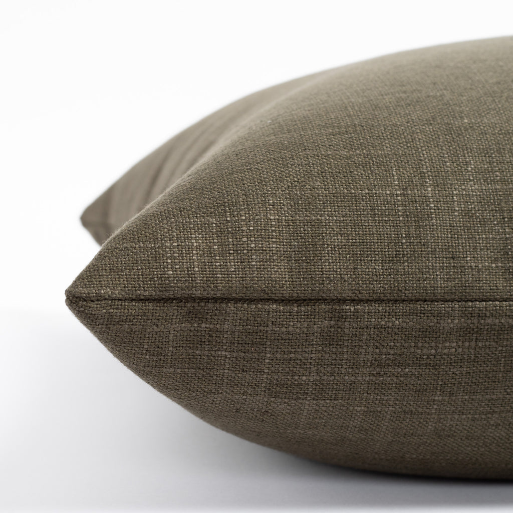 an olive green throw pillow : side photo