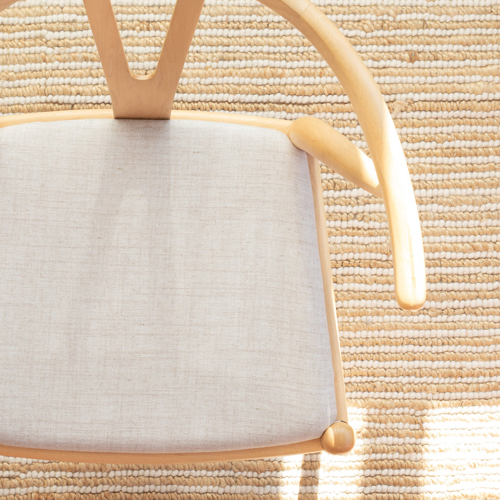 a light oatmeal upholstered chair seat