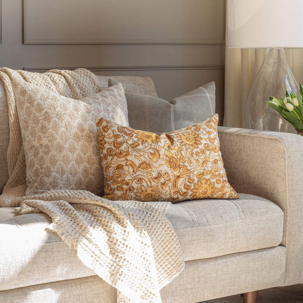 living room scene with soft greys and neutral textures from Tonic Living - Baker burlap, Camden Plaid, Inez Gold 14x20