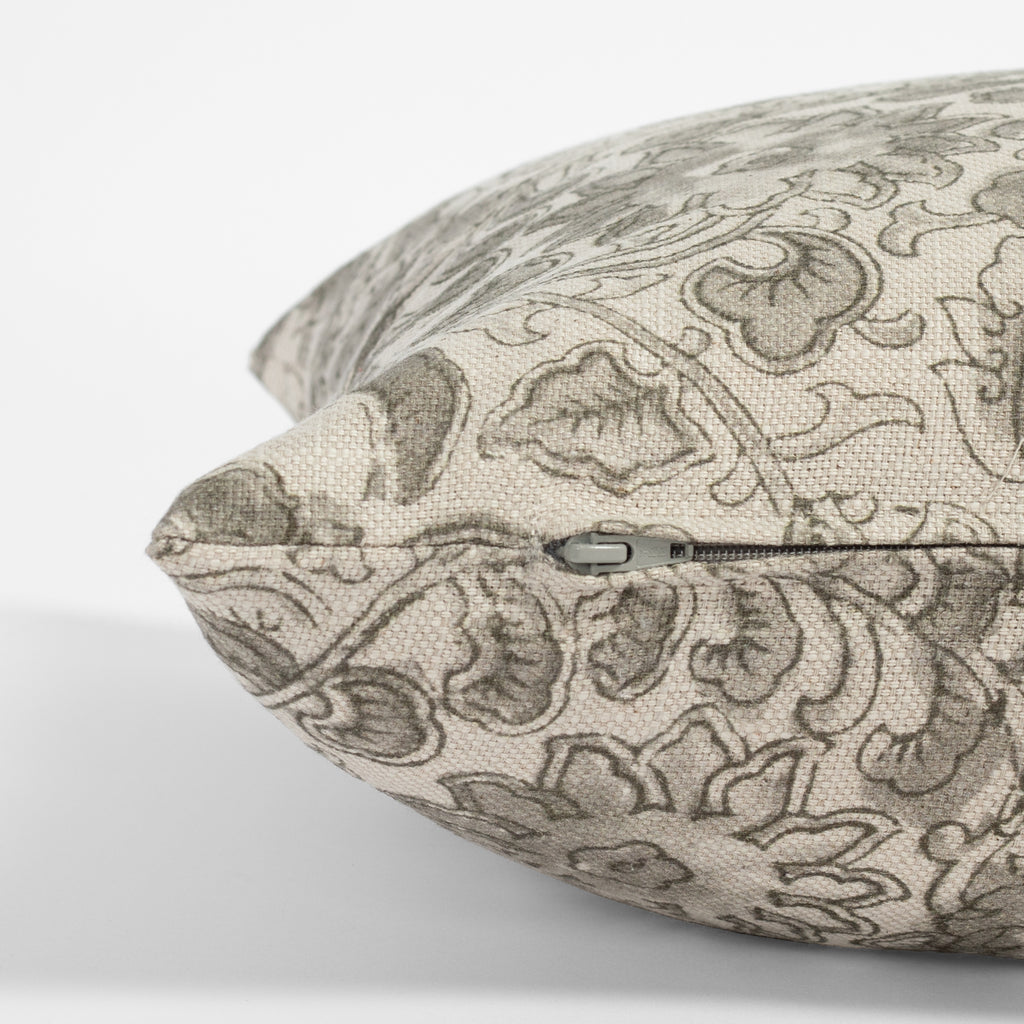 a grey swirling floral vine print throw pillow : zipper detail
