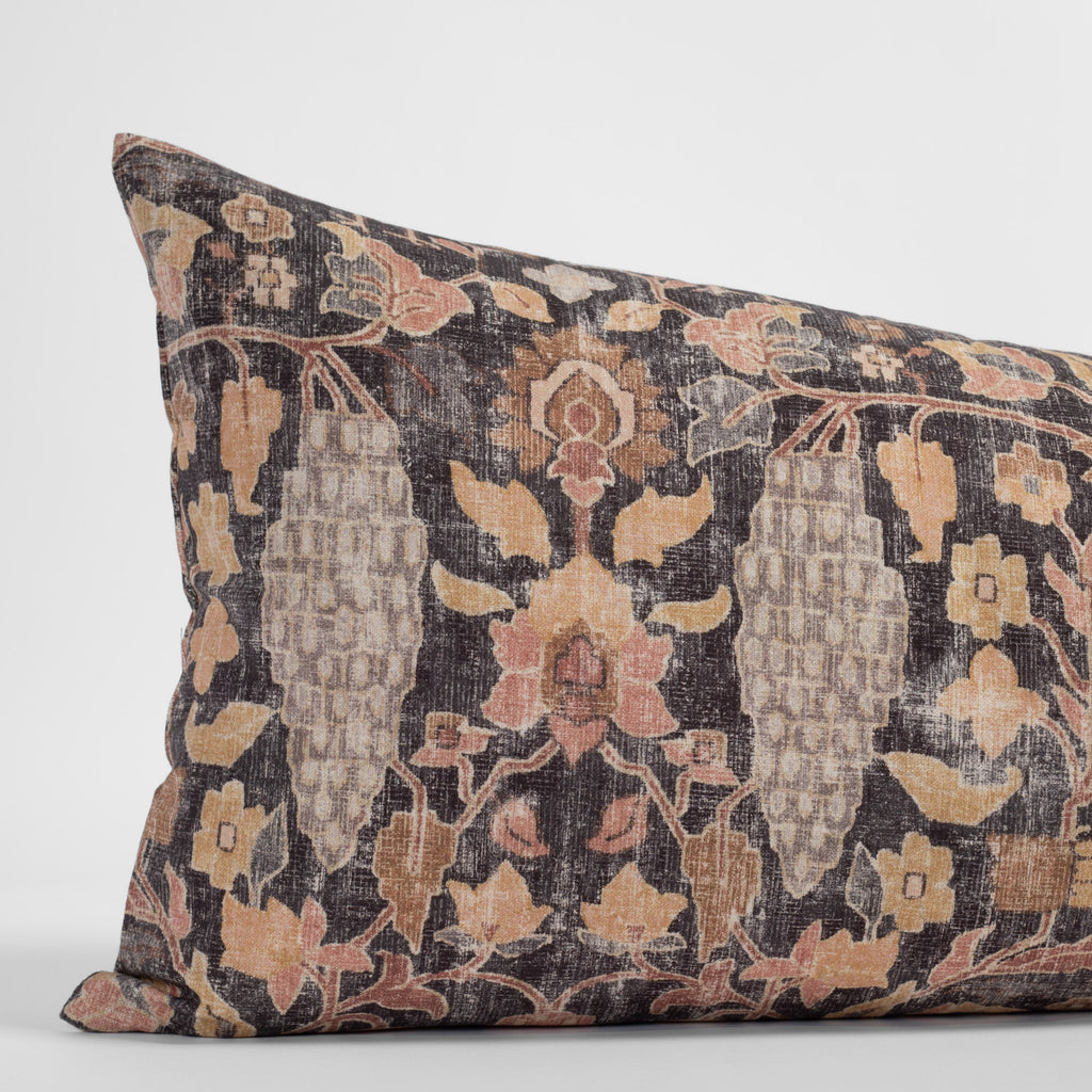 Kalida Walnut, a faded black and earth toned floral vintage tapestry print bolster pillow