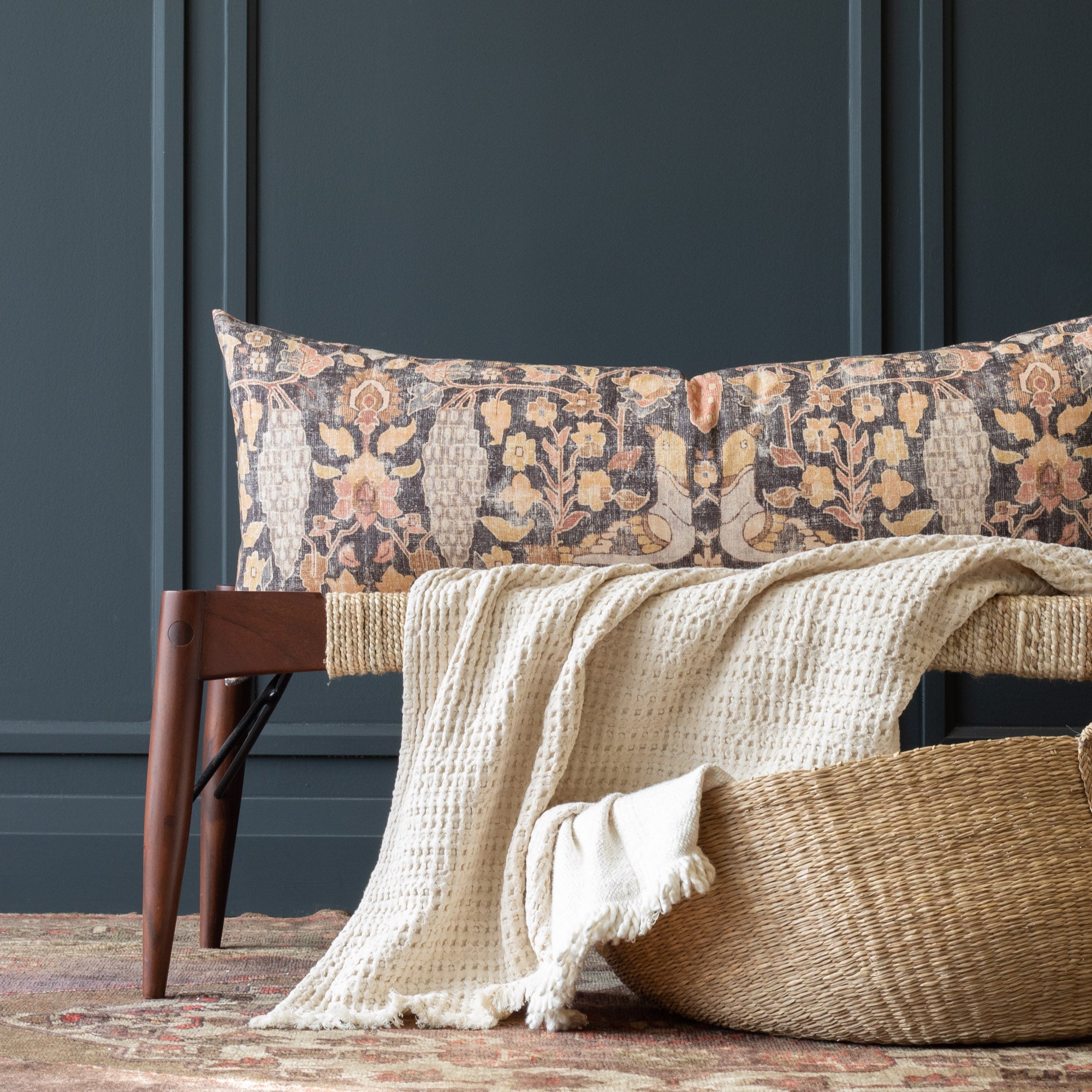 a cozy pillow with a beautiful botanical print in warm earthy colours