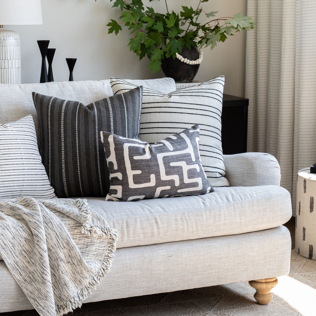  karru charcoal grey pillow on stanhope pearl sofa, with other black & white tone pillows