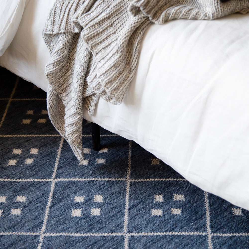Kota, a blue and cream diamond pattern rug at Tonic Living