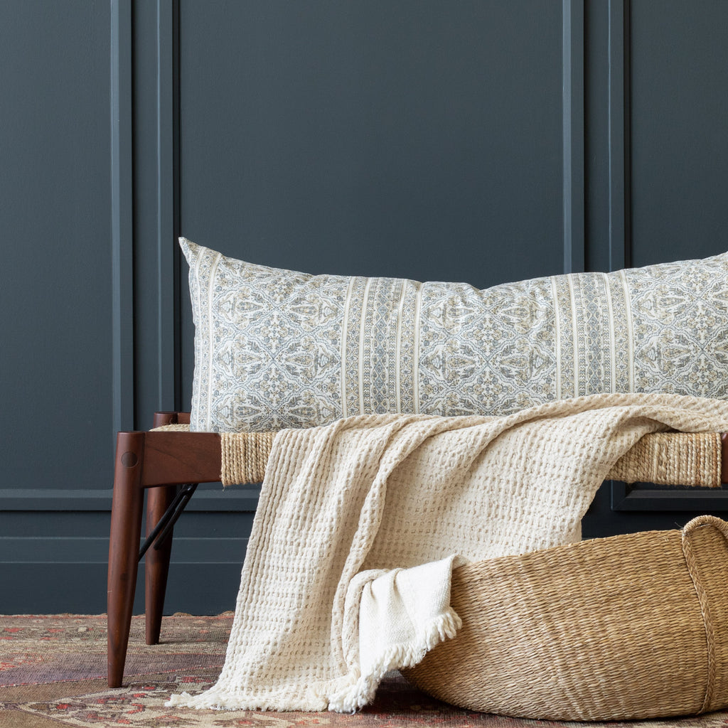 a tan and light blue-grey motif intricate block print throw pillow from Tonic Living