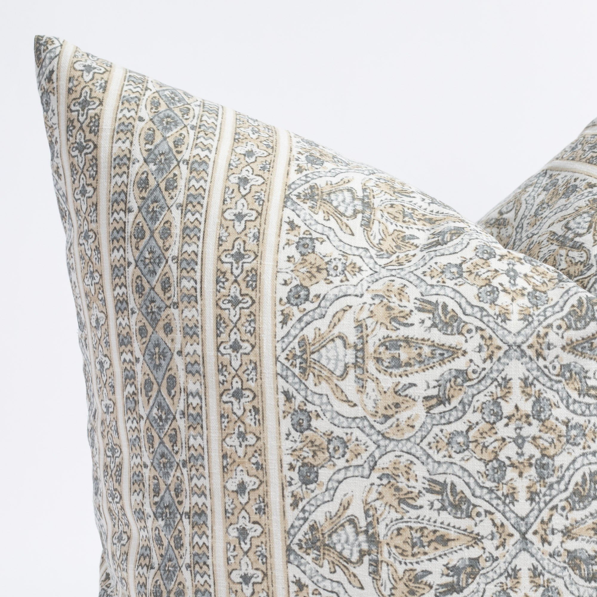 Lasha, a tan and light blue-grey block print throw pillow : close up view