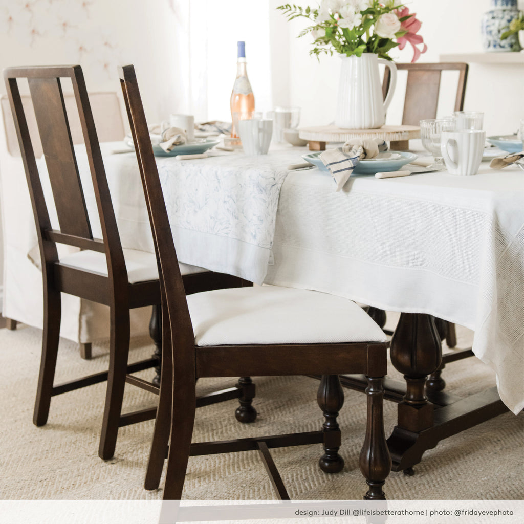 Upholstered dining chair seat cushion. White high performance upholstery fabric with a herringbone pattern and texture. Design by Judy Dill @lifeisbetterathome