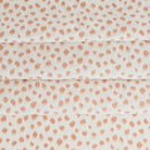 a white and pink inky polka dot print home decor fabric