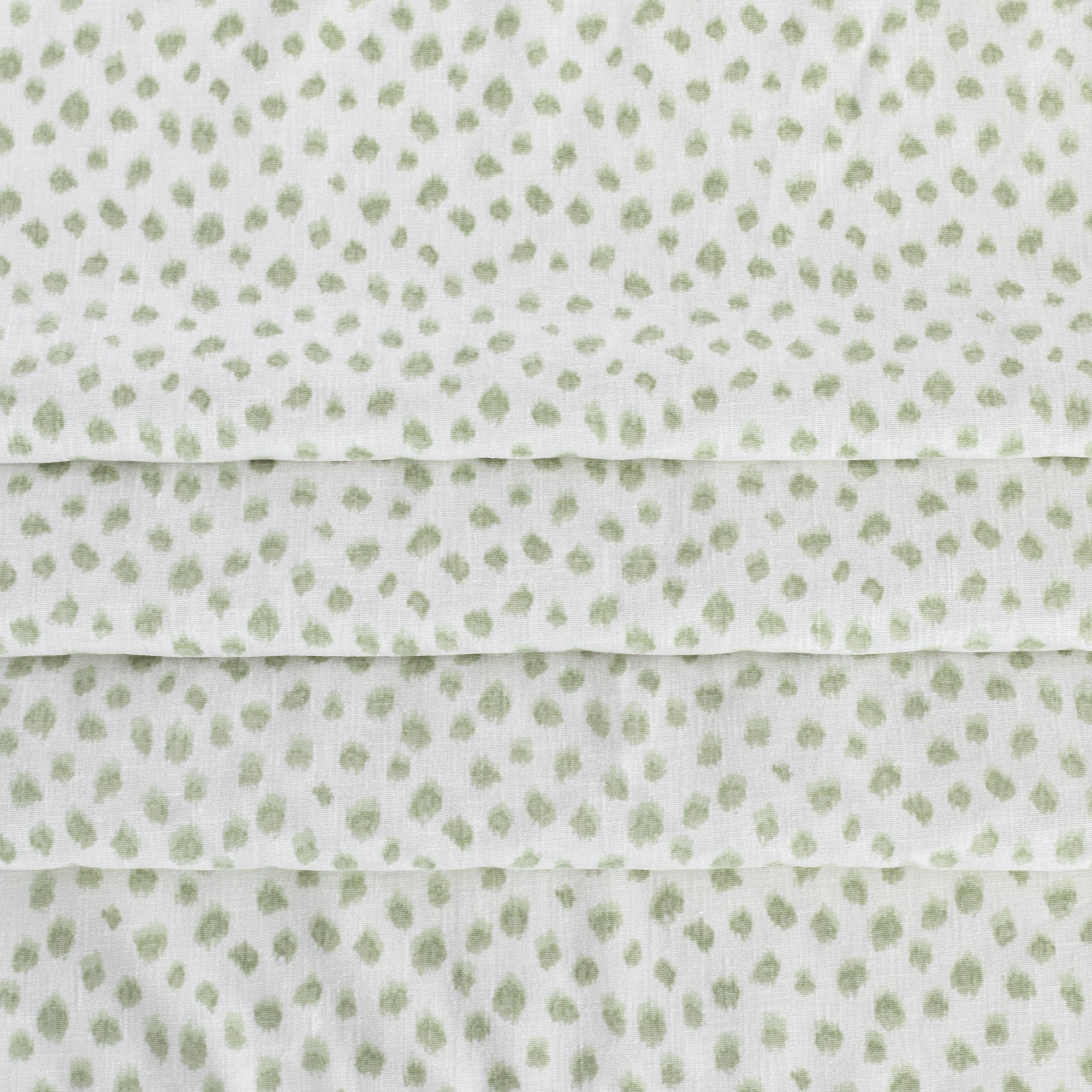 a white and green inky dot print home decor fabric