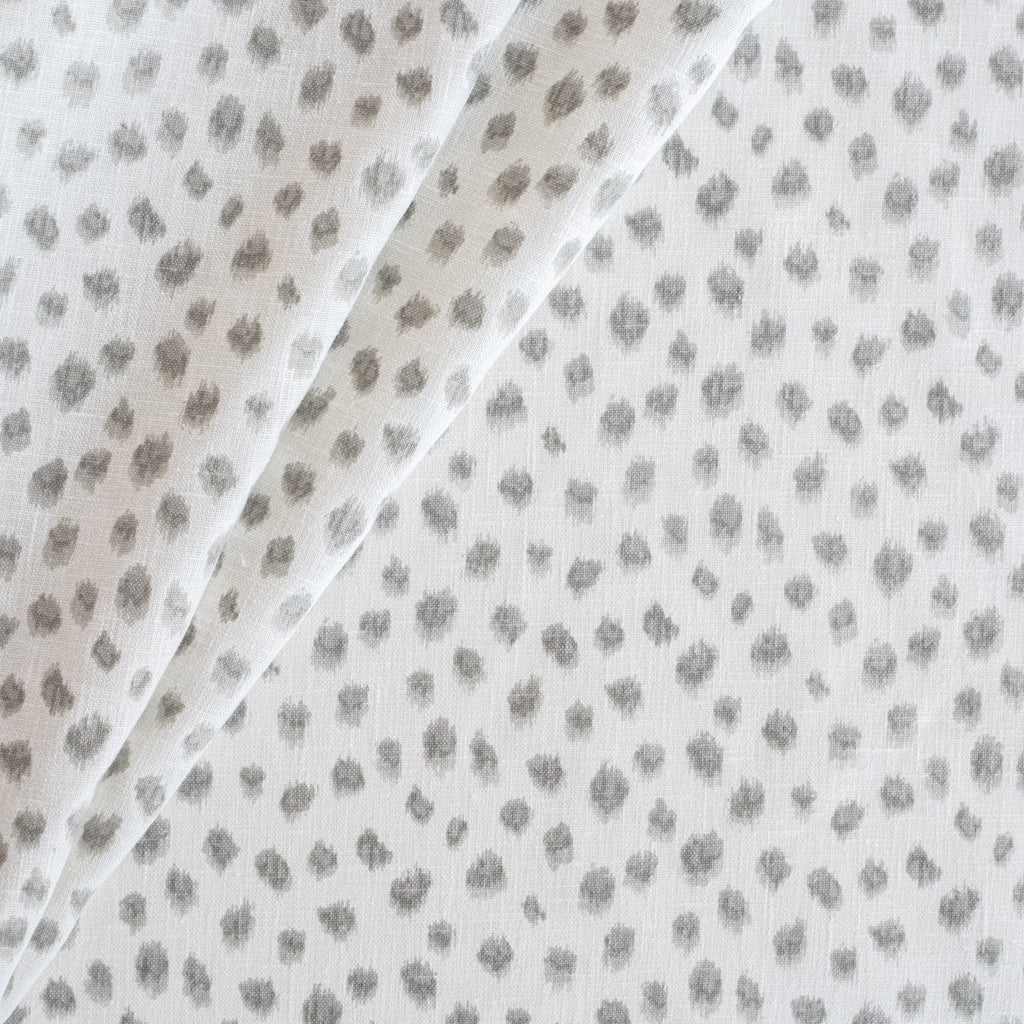 a white and silver grey inky dot print drapery fabric