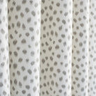 Mara Spot, a white and soft grey dot print curtain fabric