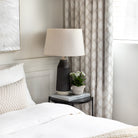 Melrose Sand fabric drapes in a neutral coloured bedroom vignette