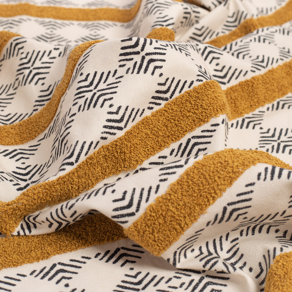 Mirza Stripe, a black and ivory geometric print with a golden embroidered stripe fabric : view 3