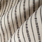 Misto Stripe Cream and Black, a cream and black striped Crypton home performance fabric : close up view