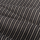 Misto Stripe Charcoal, a faded black and cream striped Crypton home performance fabric : view with soft folds