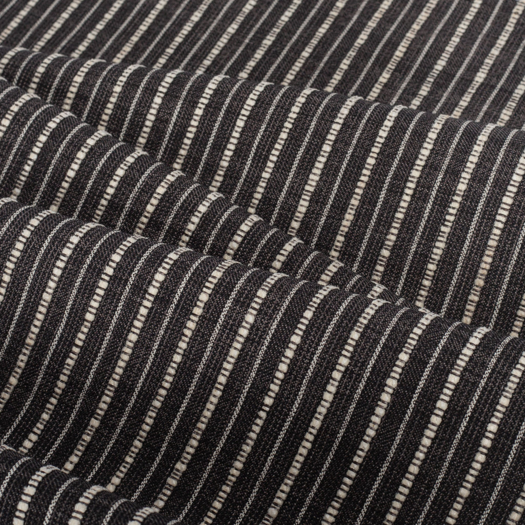 Misto Stripe Charcoal, a faded black and cream striped Crypton home performance fabric : view with soft folds