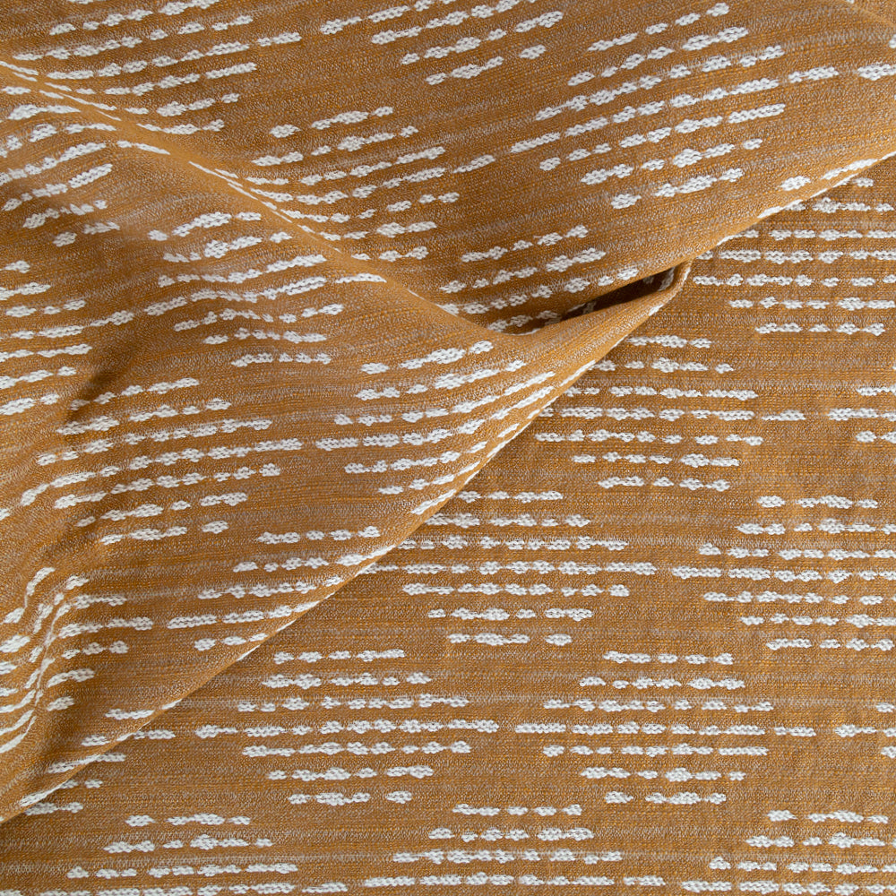 Ophelia Tumeric, a deep yellow on cream dash dot outdoor fabric from Tonic Living