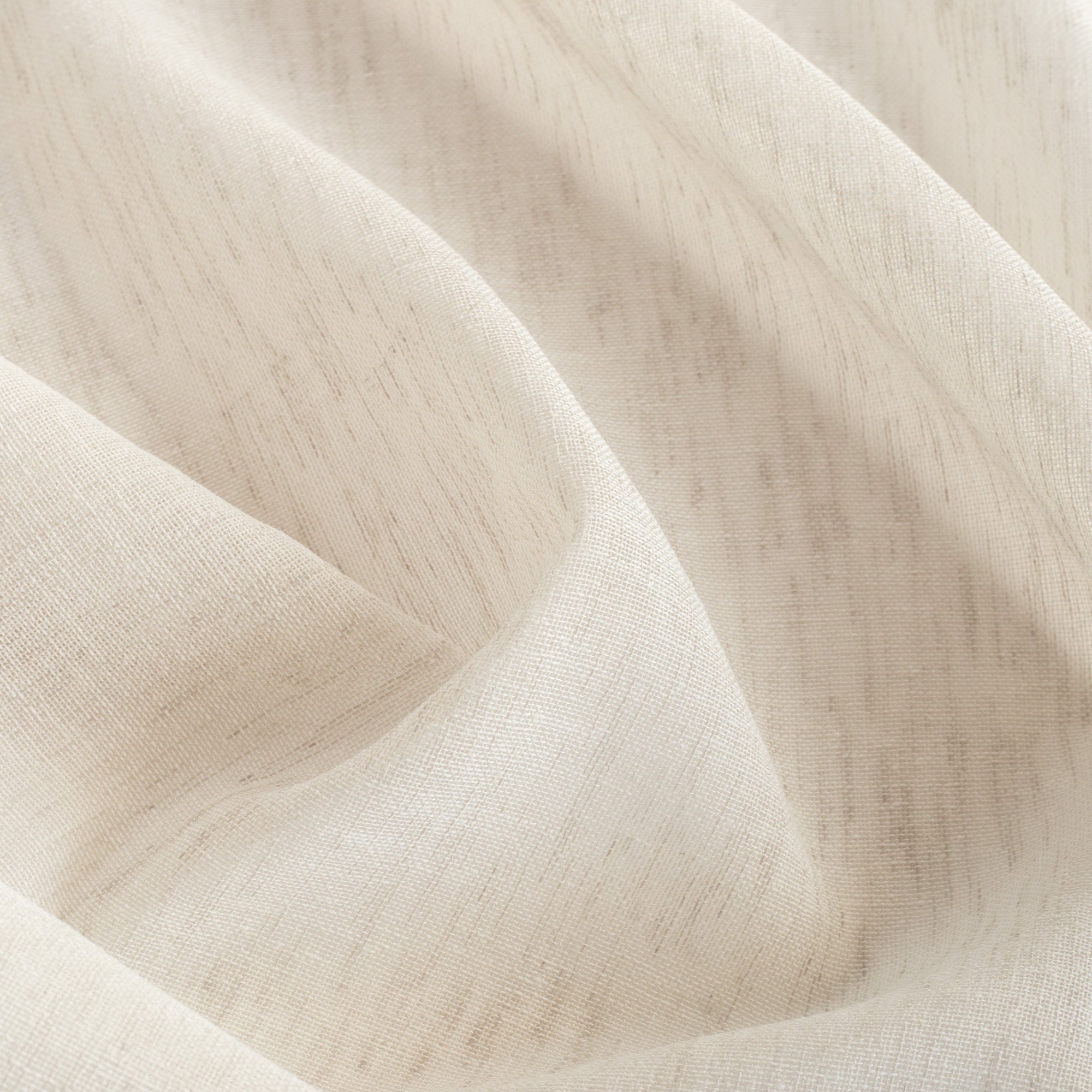 Palmero Flax, a sandy flax-toned sheer drapery fabric from Tonic Living
