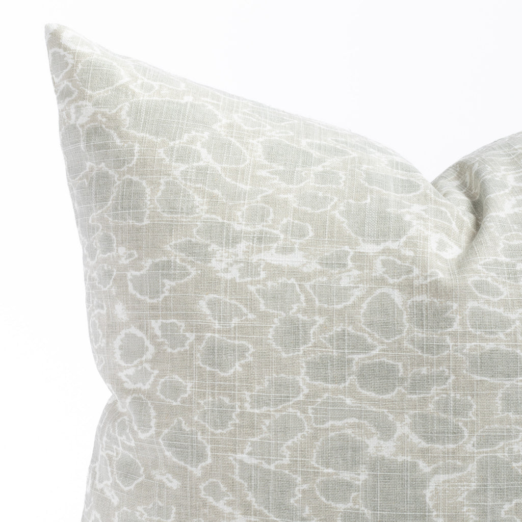 a white and seafoam green dabbled calm ocean surface print throw pillow : close up view