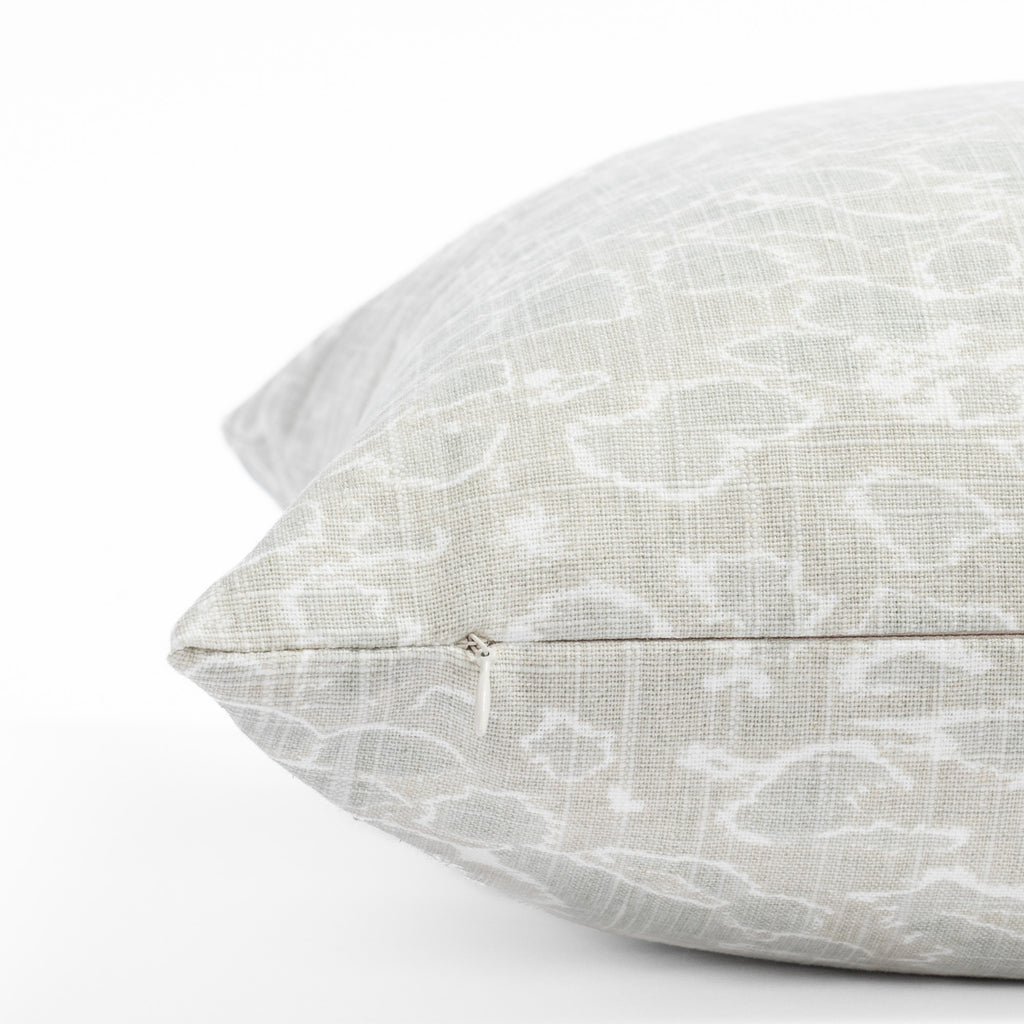 a white and seafoam green dabbled calm ocean surface print throw pillow : close up invisible zipper view