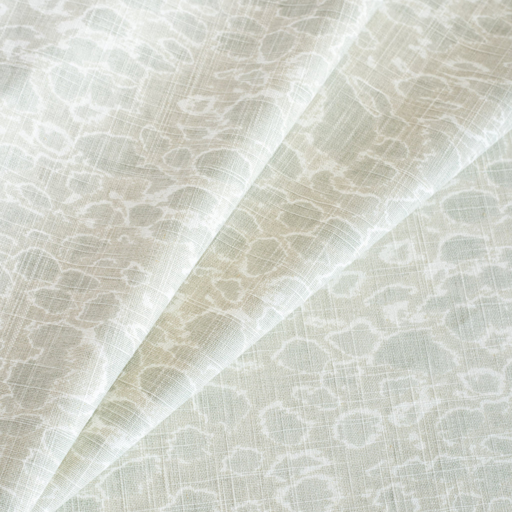 a neutral light mineral green and white abstract watery print home decor fabric 