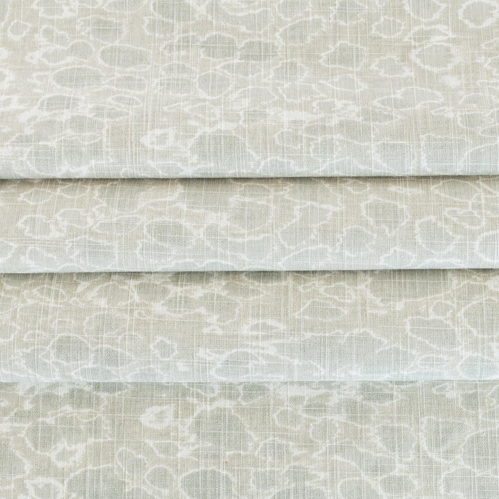 a mineral green and white abstract watery print multi use fabric 