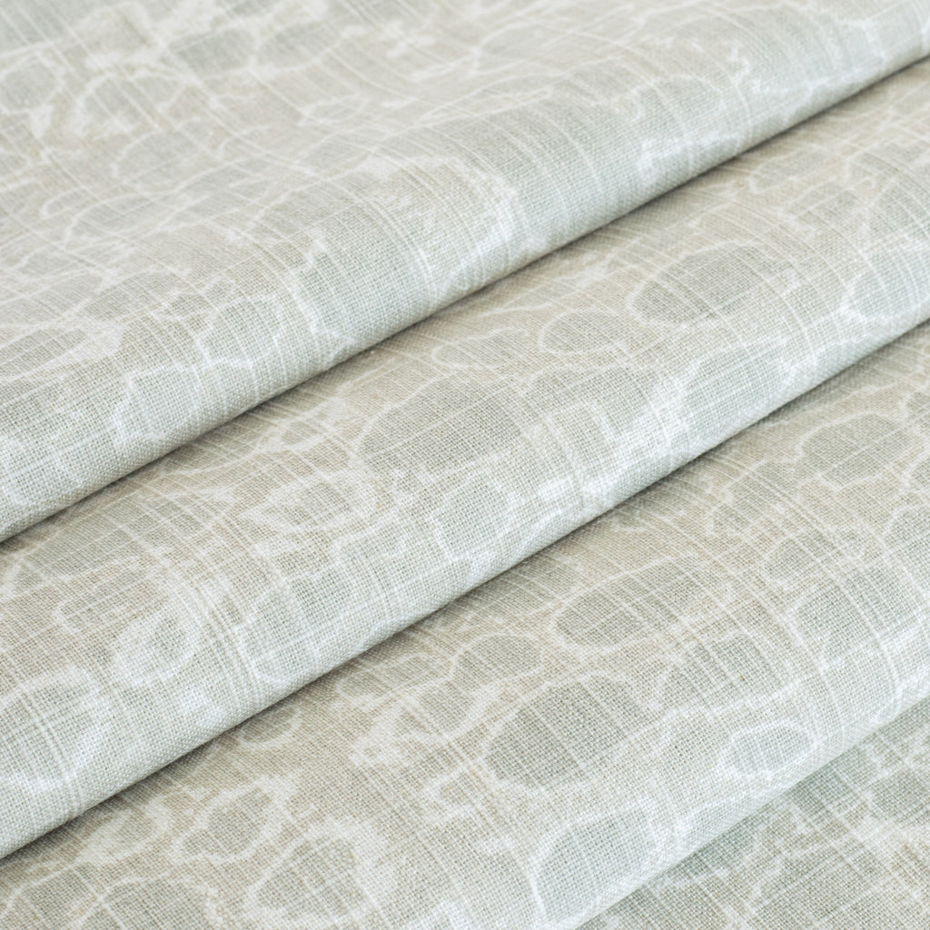 a mineral green and white abstract watery print curtain fabric 