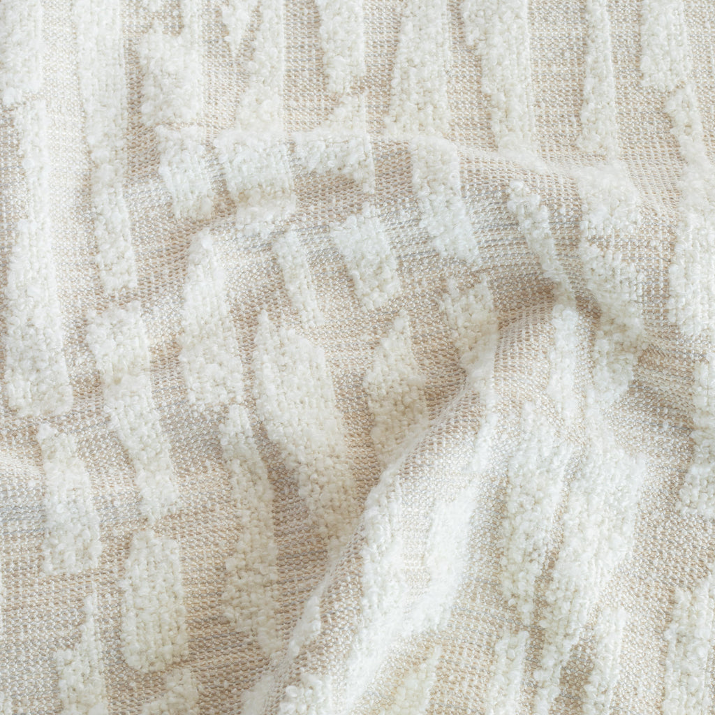a cream, abstract patterned, boucle textured designer fabric