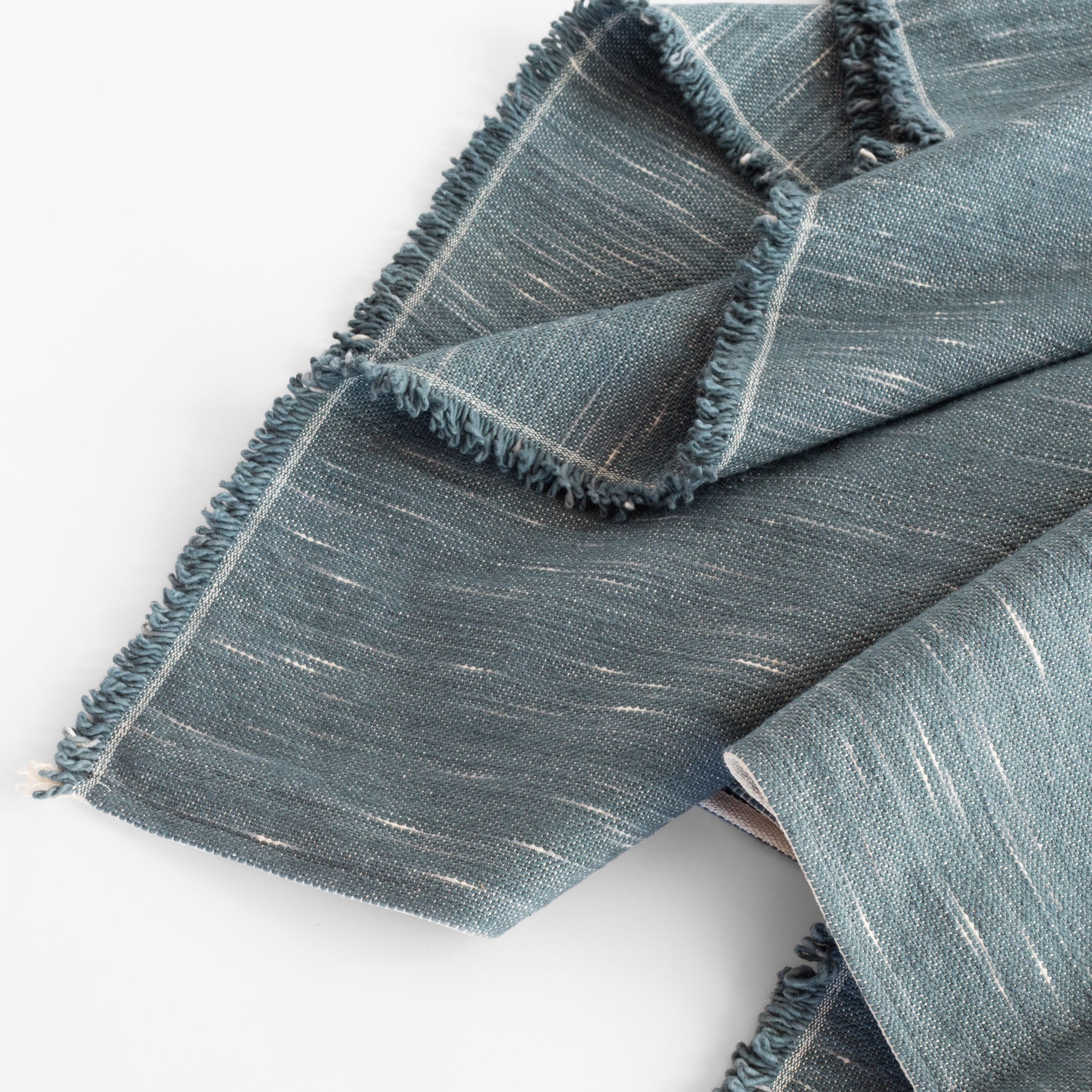 Rafael Stone Blue, a denim blue chunky weave cotton throw blanket from Tonic Living