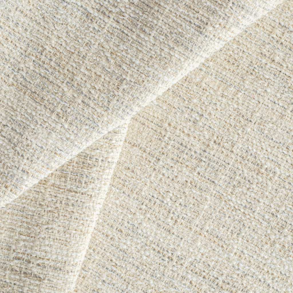 a beige textured woven upholstery fabric 
