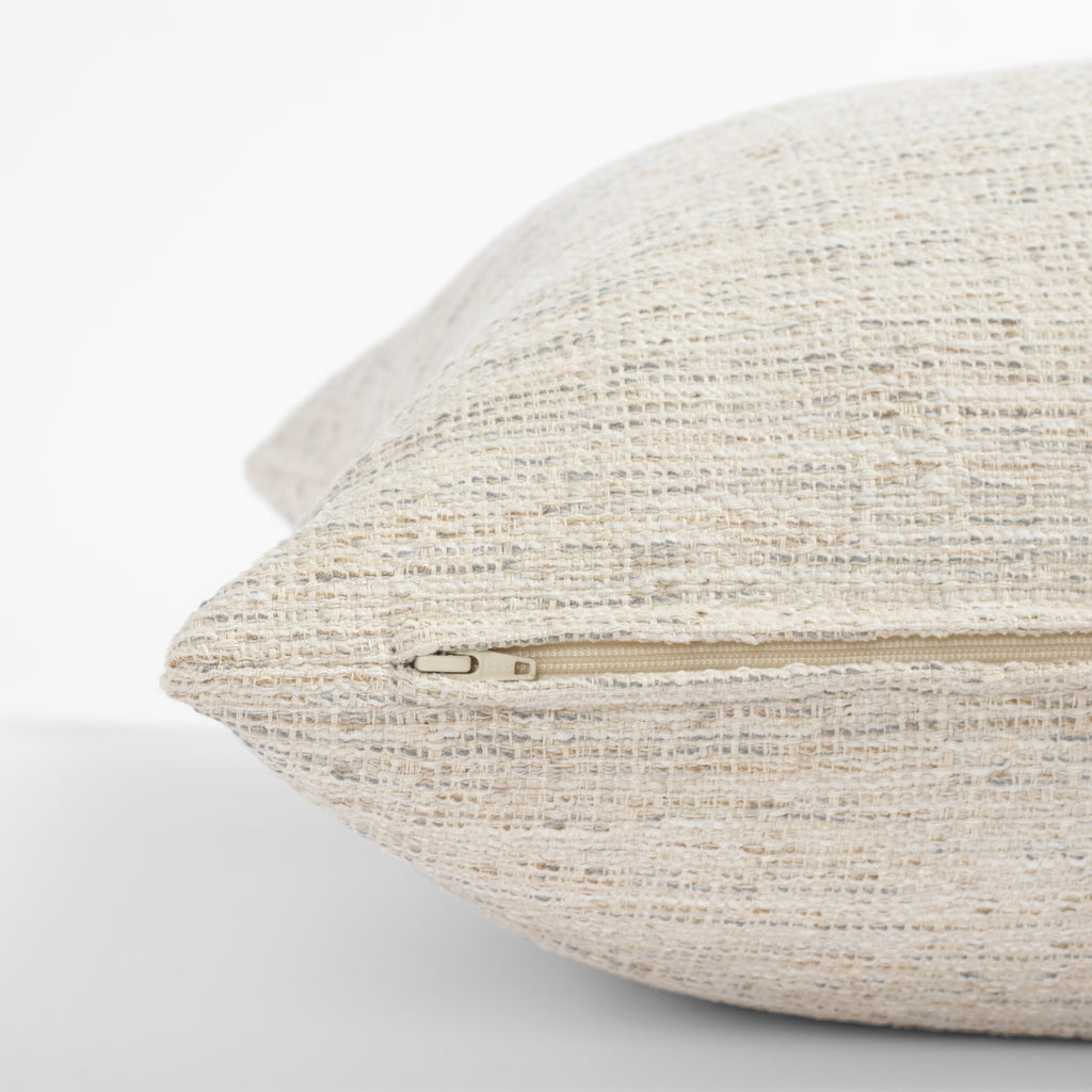 a cream beige textured throw pillow -  zipper detail