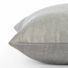 a soft light grey pillow : close up side view 